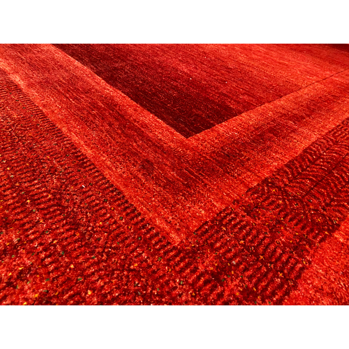 Red Gabbeh-Luri rug: Detailed pile structure with border and line patterns