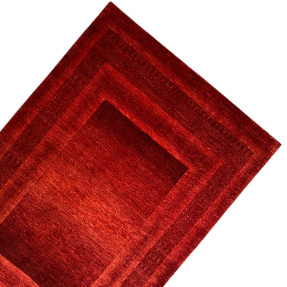 Red Gabbeh-Luri rug with a border band and central medallion
