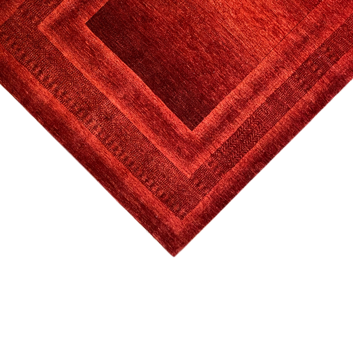 Red Gabbeh-Luri rug with medallion and visible decorative lines in detail