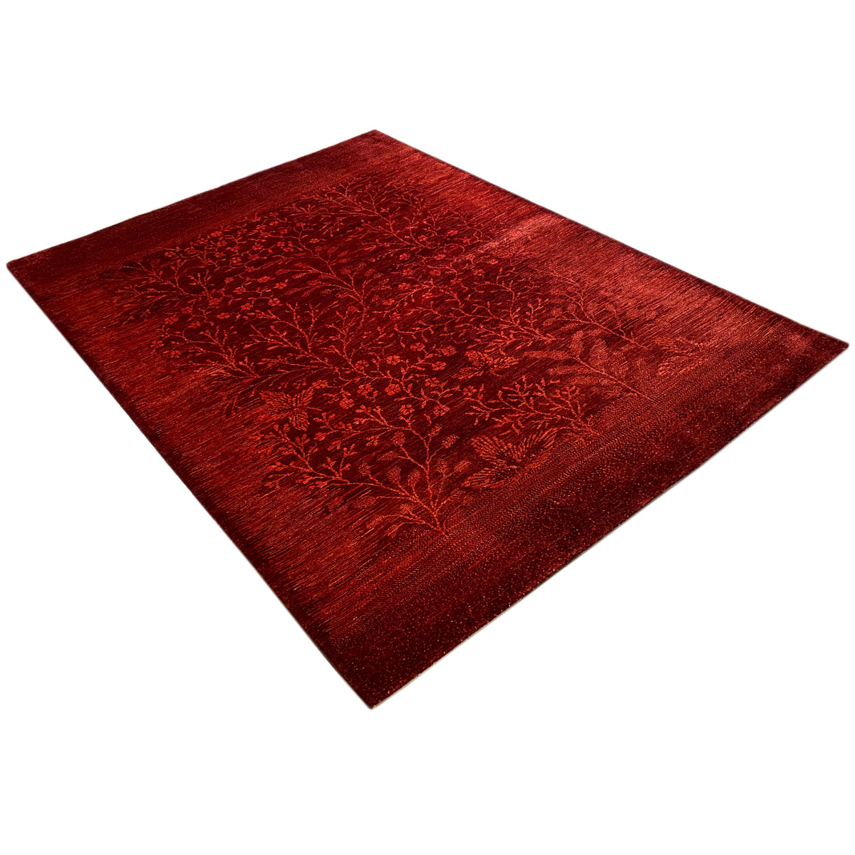 Red carpet in a diamond pattern with dense floral branch motifs