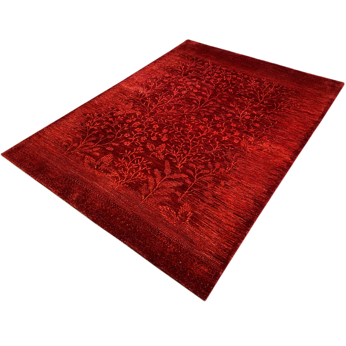 Red carpet with a delicate leaf-vine pattern, diagonally aligned