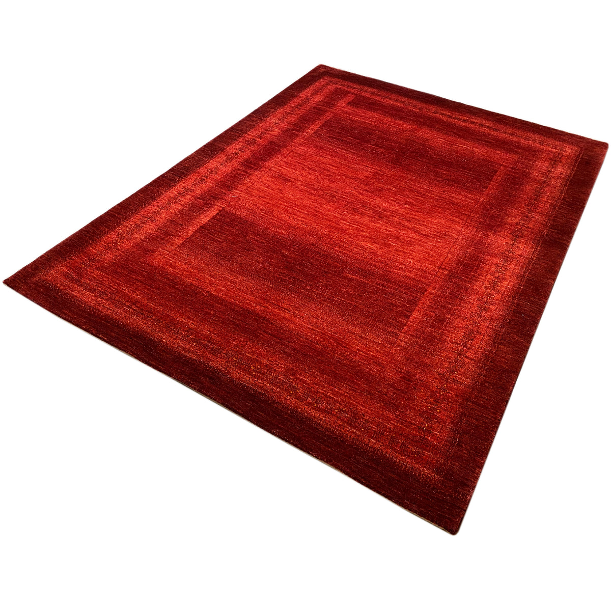Red carpet with a geometric pattern, spread out diagonally