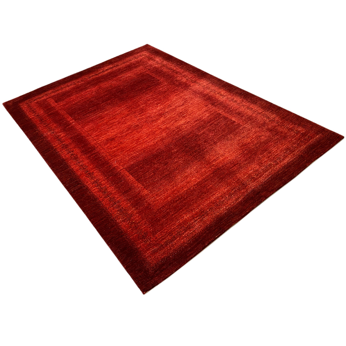 Red carpet with a geometric pattern, top-down view