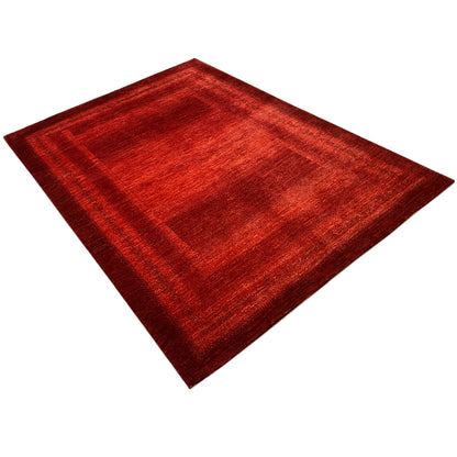Red carpet with a geometric pattern, top-down view