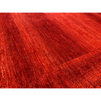 Red carpet with a fine, dense pile structure in close-up detail