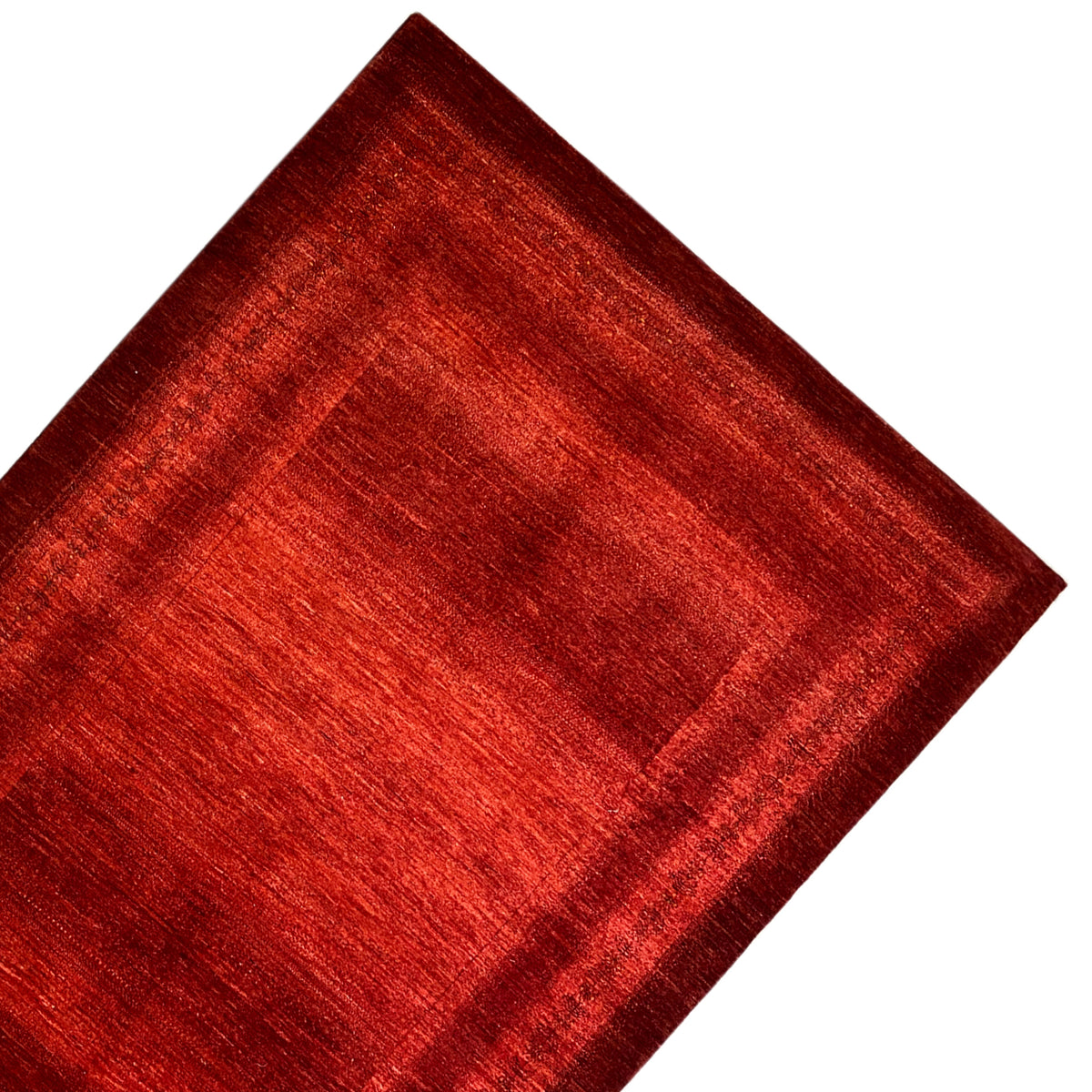 Red carpet with border and geometric lines, close-up