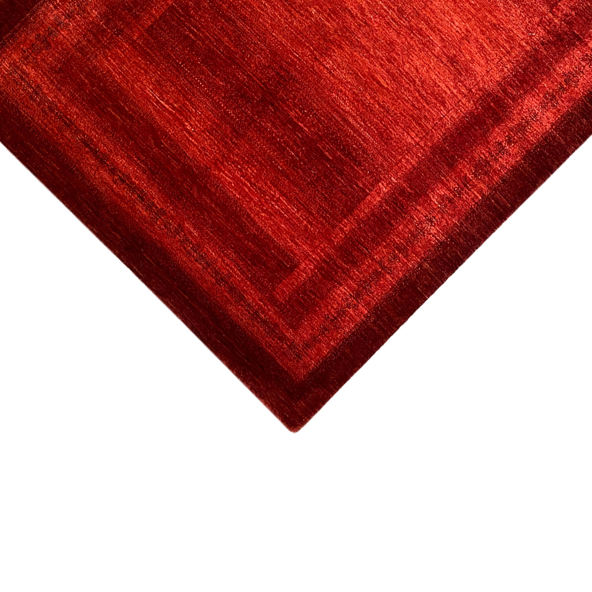 Red carpet with a geometric field pattern, close-up from above