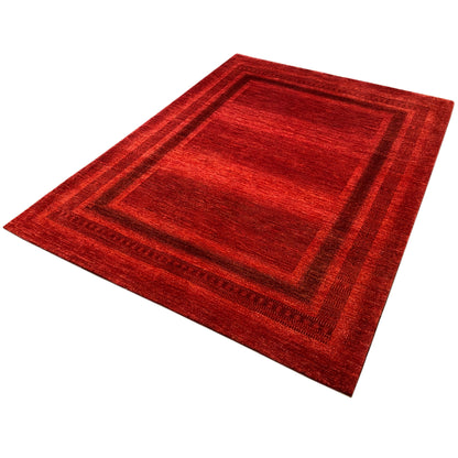 Red carpet with a diagonal cut, square motif, and contrasting border stripes