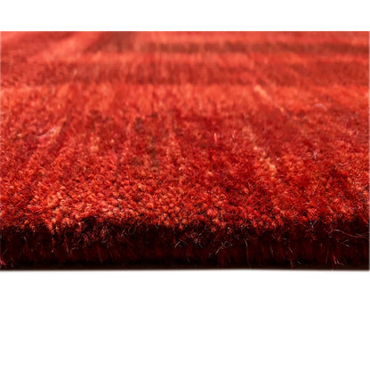 Rug underside with dense pile and an even red color tone