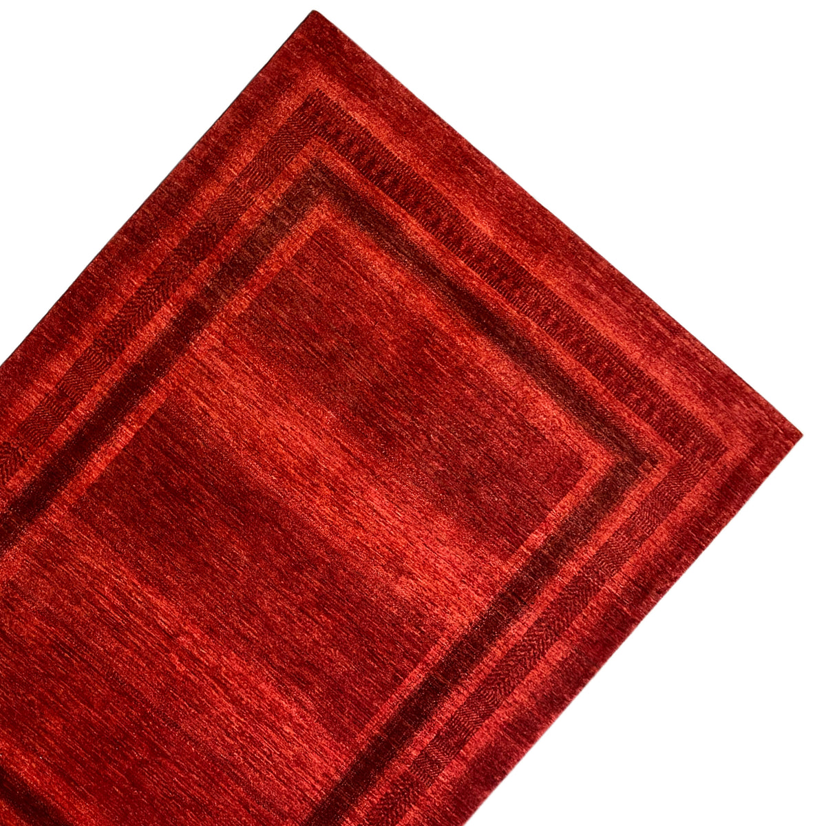 Red carpet with a square pattern and several narrow decorative stripes