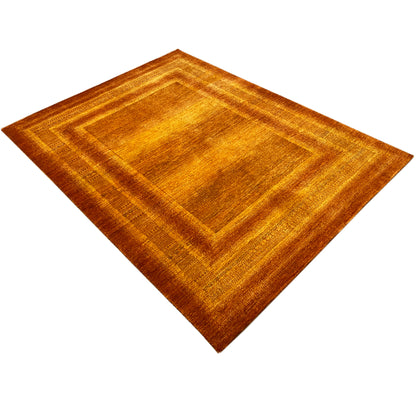 Orange-brown rug with an embossed-looking diamond-and-square pattern