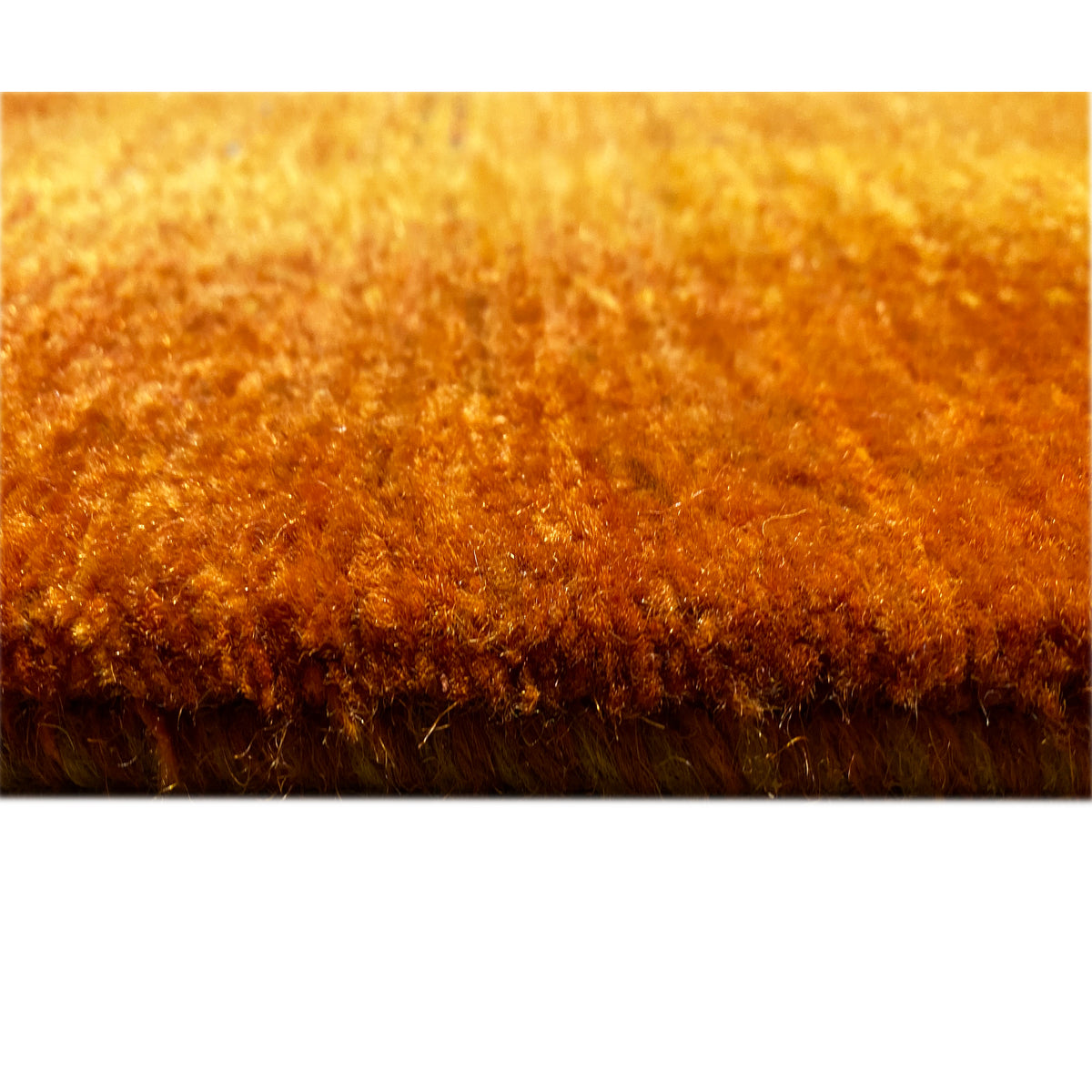 Rug edge with fringe in brown and orange-brown, dense pile