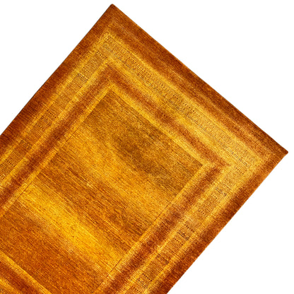 Detailed view: orange-brown carpet pattern with inner square