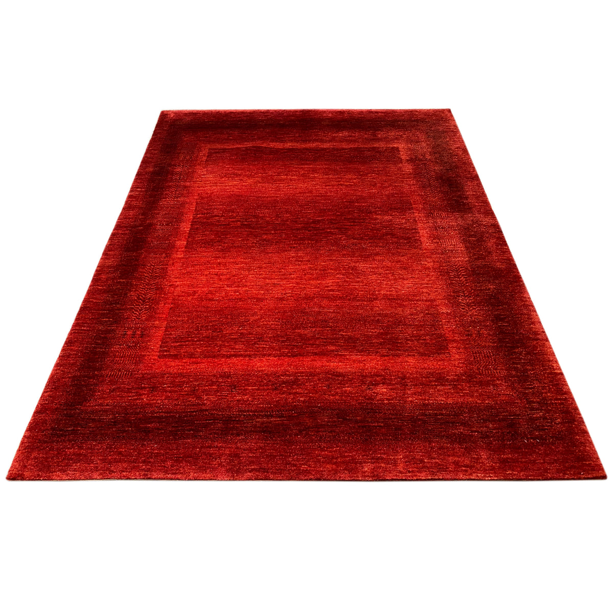 Red carpet with a central square pattern and surrounding border