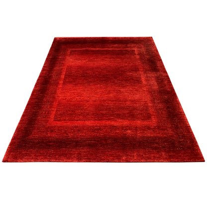 Red carpet with a central square pattern and surrounding border