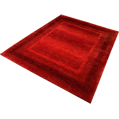Red carpet with a rectangular pattern in the center and a lightly textured surface