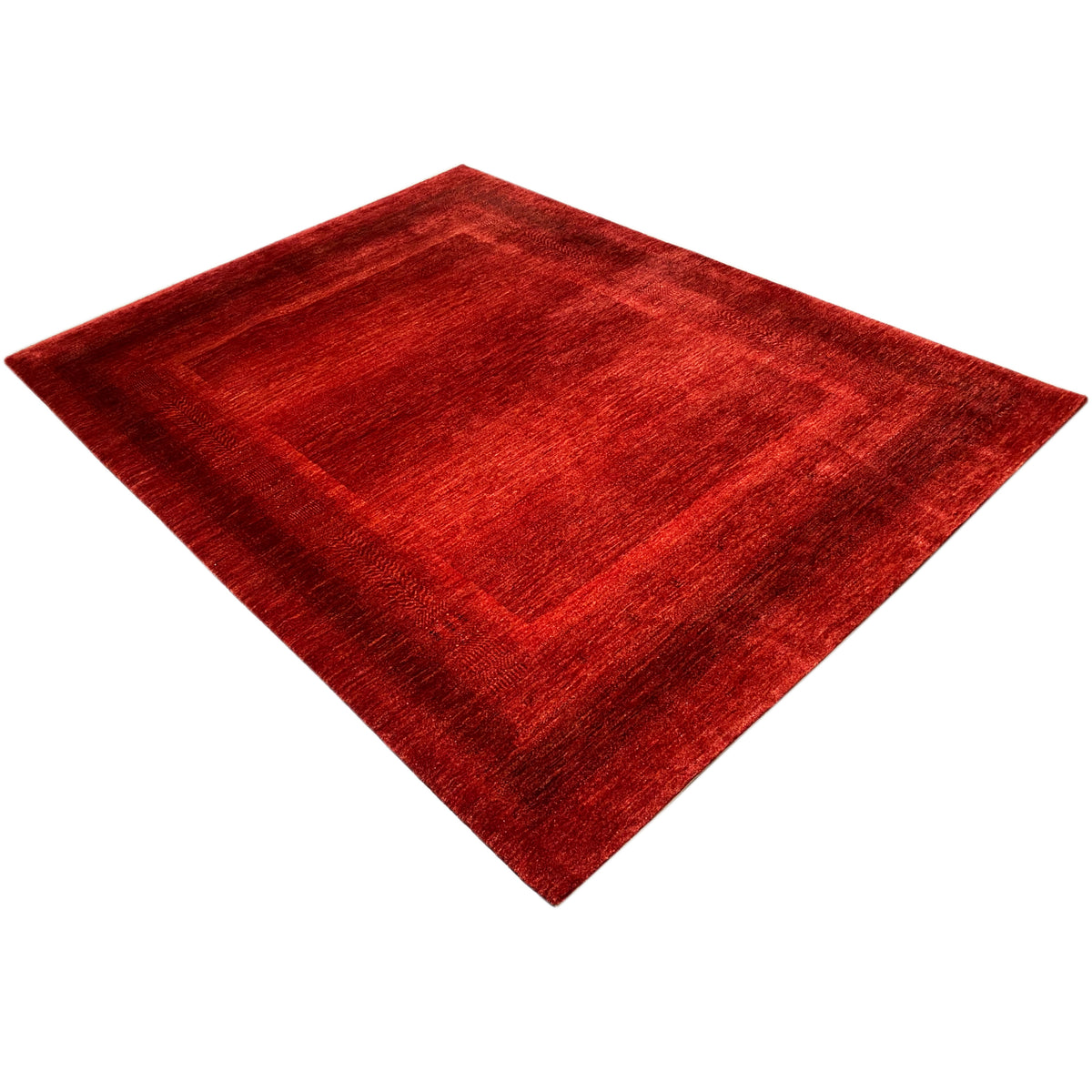 Red carpet with a square medallion-like pattern and fine texture
