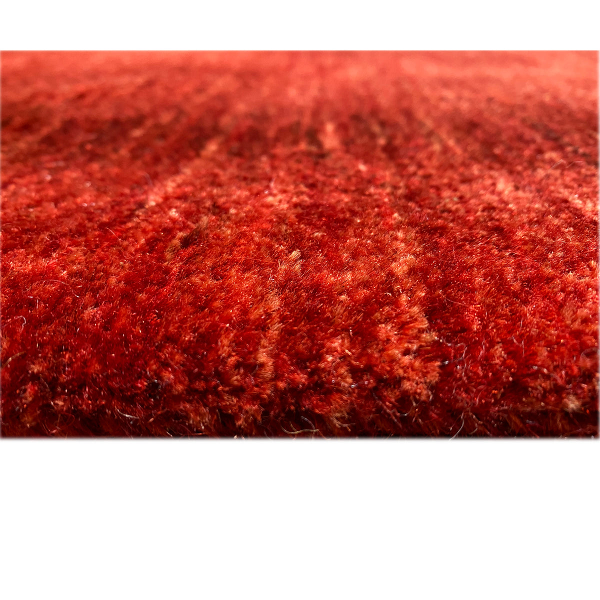 Red carpet with a dense pile, detailed close-up of the surface