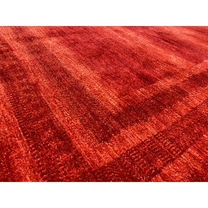 Close-up of a red carpet surface with a dense texture and fine pattern lines