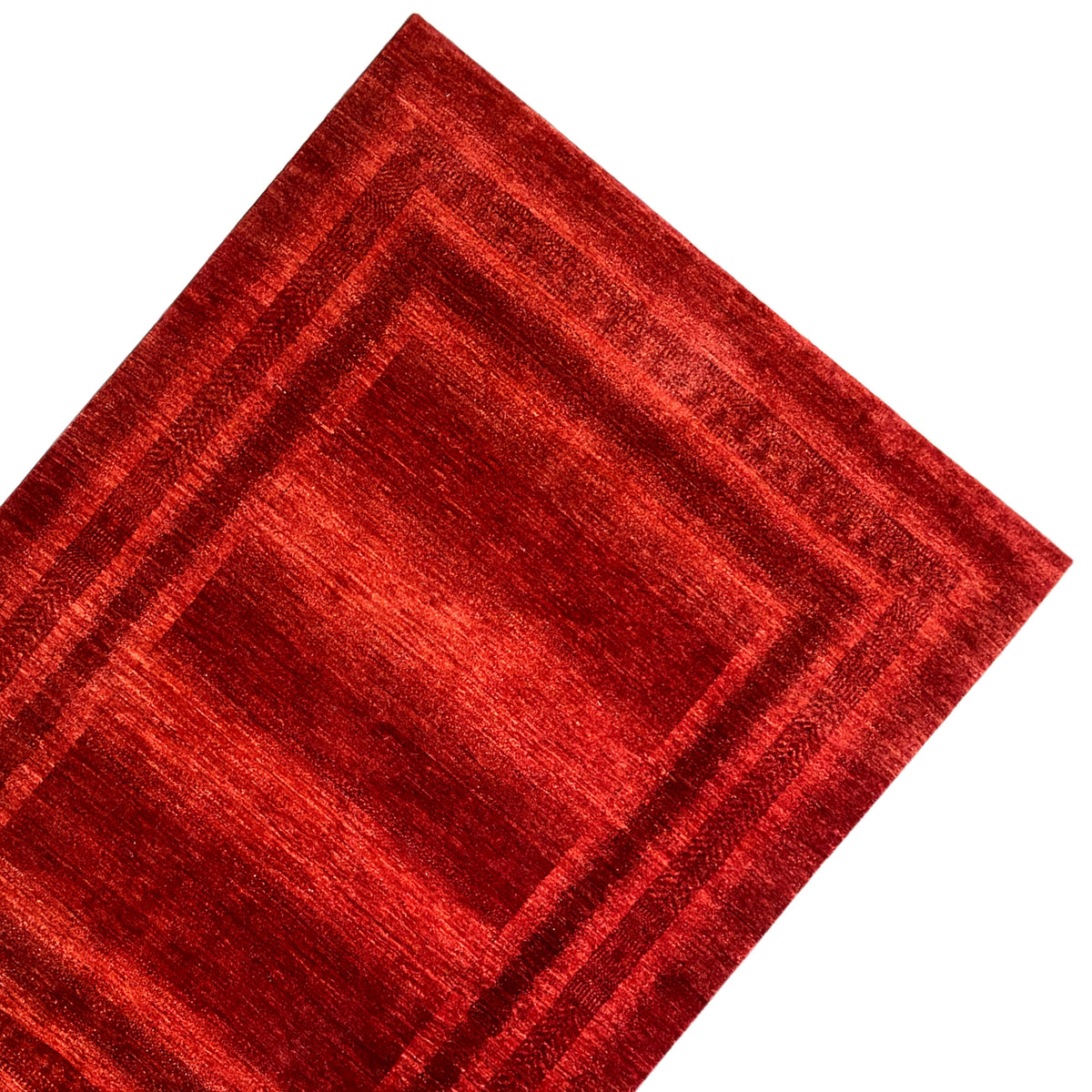 Red carpet with a central square and surrounding lines, diagonal perspective