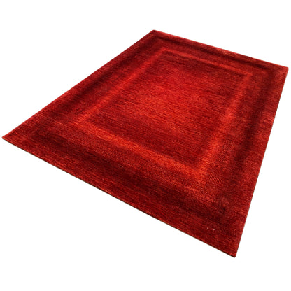 Red carpet laid diagonally, subtle diamond pattern, and even pile density