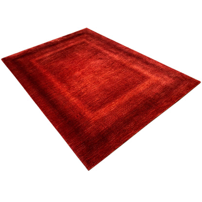 Red carpet with a square patterned area and soft, short-pile texture