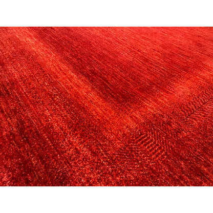 Red carpet detail with a fine, heathered texture and silky sheen