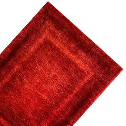Red carpet viewed from the front, rounded pattern area, and bold colors
