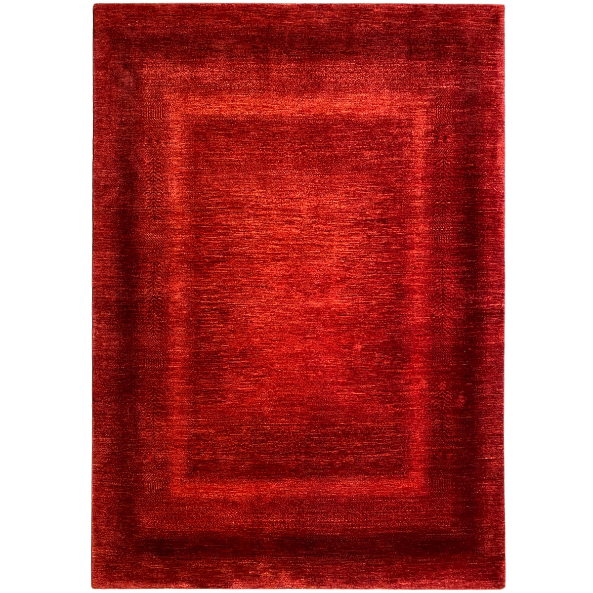 Red rug with a rectangular border pattern, flat-woven texture