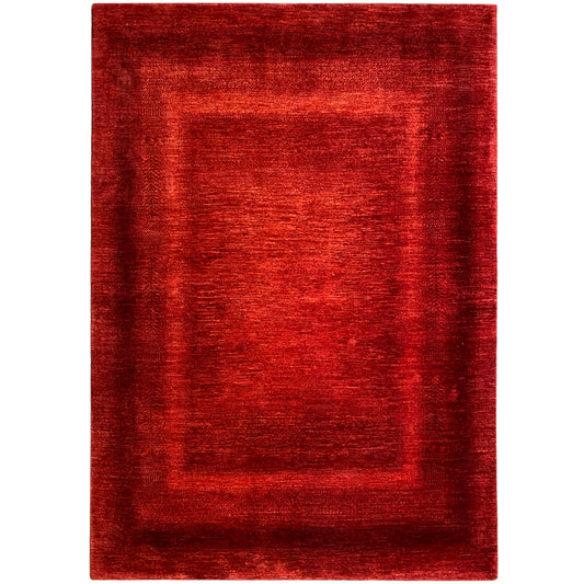 Red rug with a rectangular border pattern, flat-woven texture