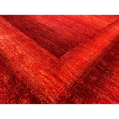 Gabbeh-Luri rug: close-up of the red weave and faded pattern lines