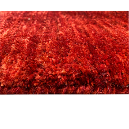 Gabbeh-Luri rug: close-up of the red pile with a dense, fine surface