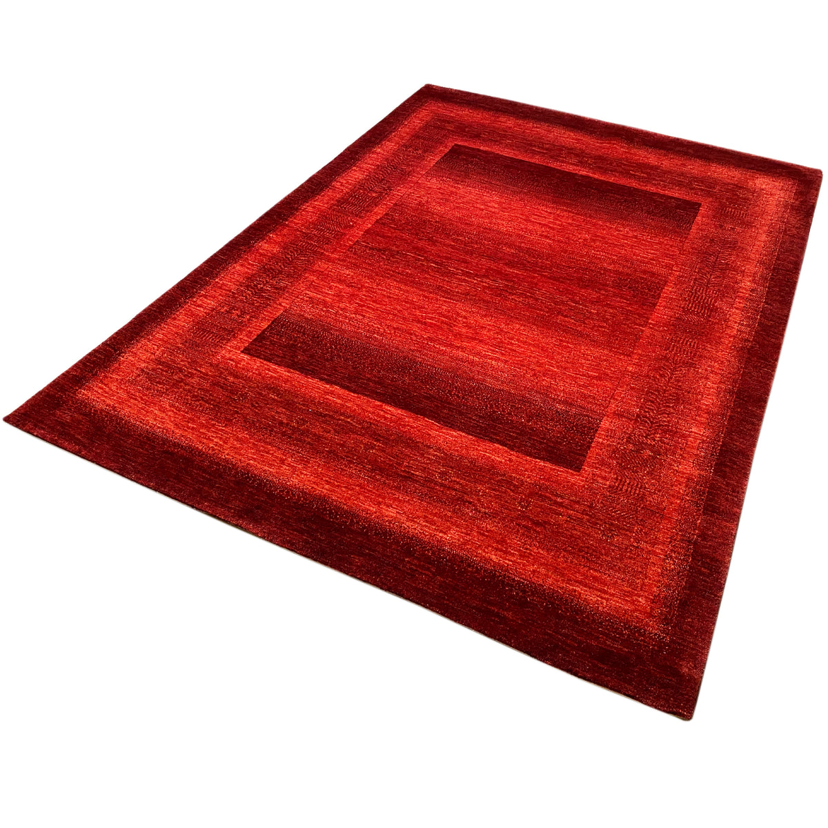 Gabbeh Luri rug in red with a symmetrical square motif and low pile.