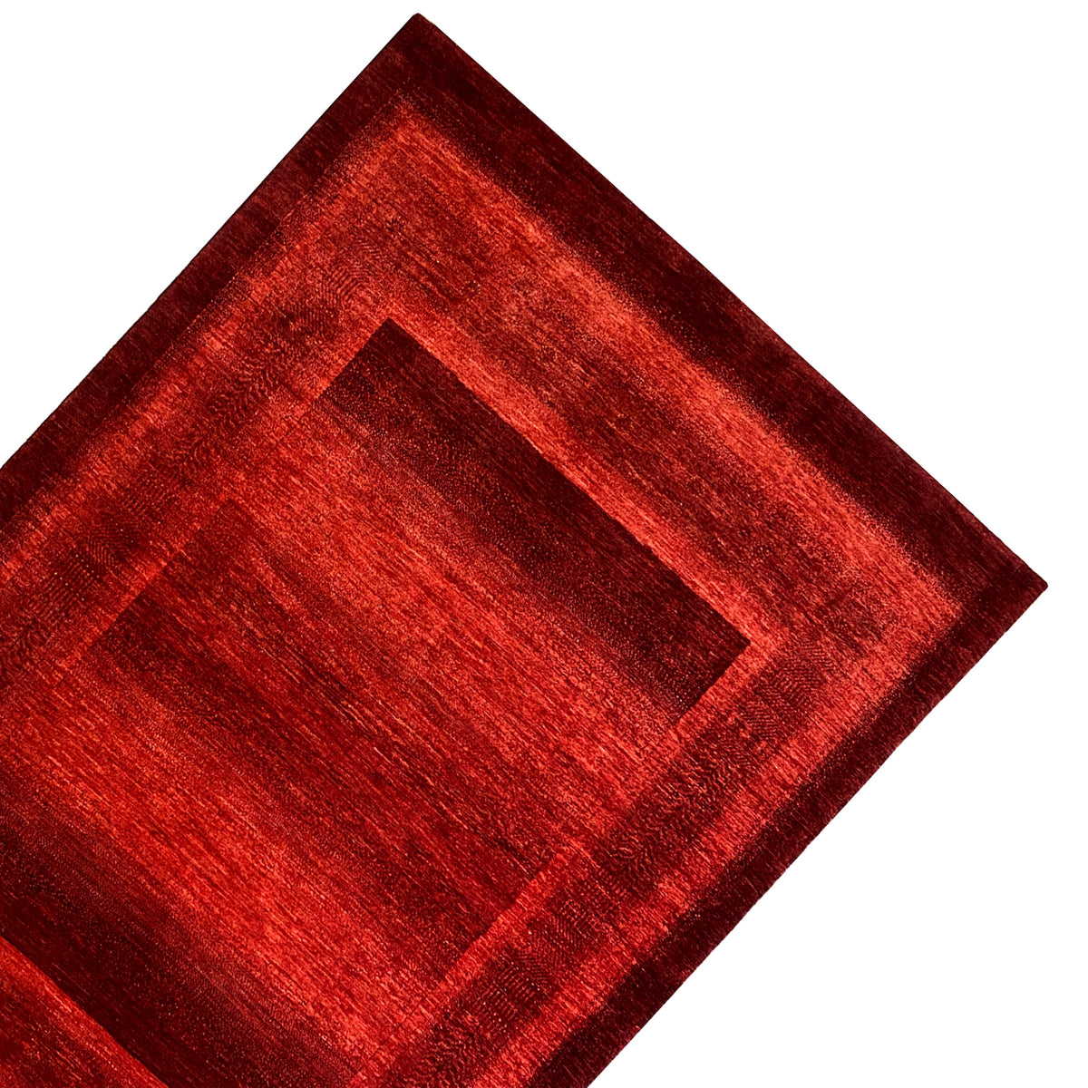 Gabbeh-Luri rug in red, close-up of the central frame and border strip.