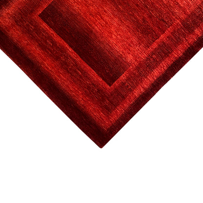 Gabbeh Luri rug in red, close-up of the patterned square with a fine texture.