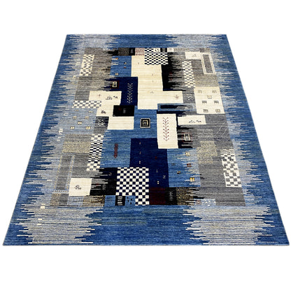 Rectangular Gabbeh rug with abstract patchwork in blue, beige, and gray