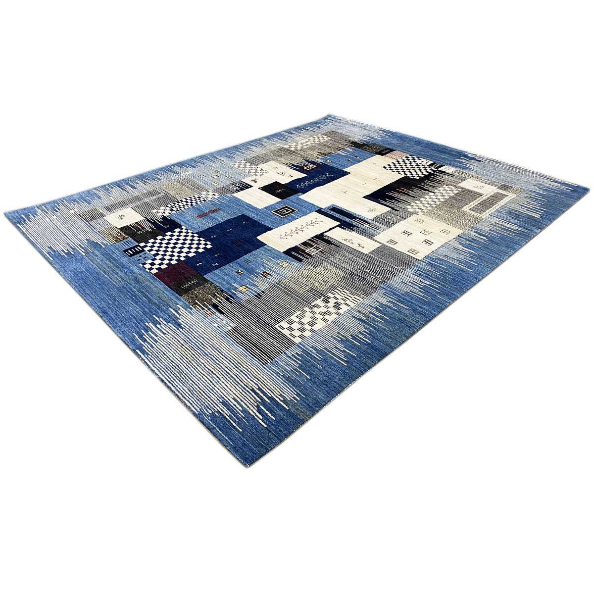 Gabbeh rug in blue and cream with geometric patterns, photographed at an angle