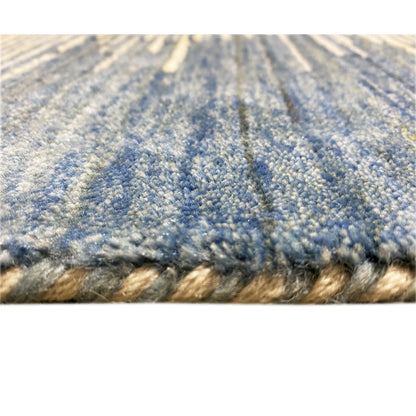Close-up of the carpet surface with blue-gray fibers and a short pile