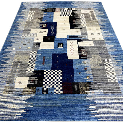 Overview: Gabbeh rug with a patchwork design in blue, cream, gray, and black