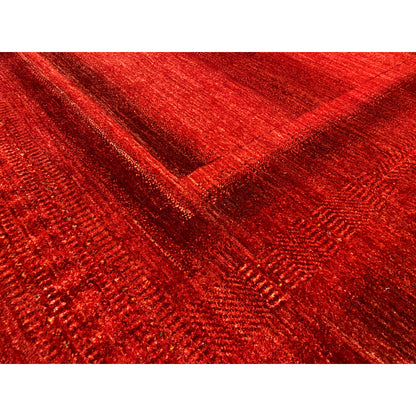 Gabbeh Luri rug in red: detailed view of the woven texture and lines in the pattern