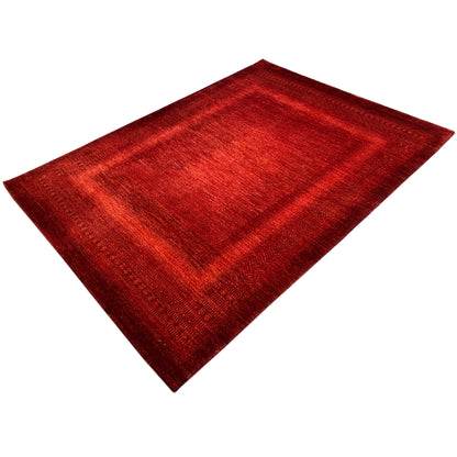 Red carpet viewed at an angle with an all-over pattern and narrow border edges