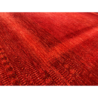 Close-up: Red carpet with a dense, mottled surface and fine woven lines