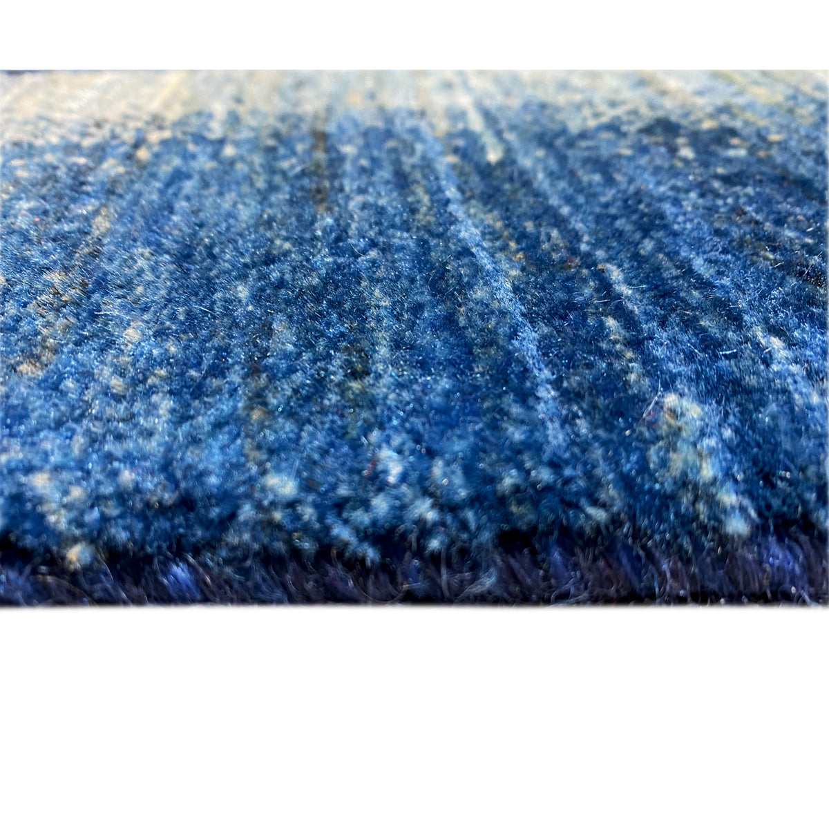 Gabbeh-Luri rug detail, mottled blue with a dense pile texture