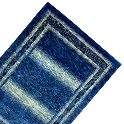 Gabbeh-Luri rug detail, blue with cream-colored corner borders and edge embroidery