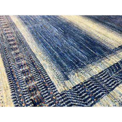 Gabbeh-Luri rug detail border, blue-and-cream pattern with colorful accents