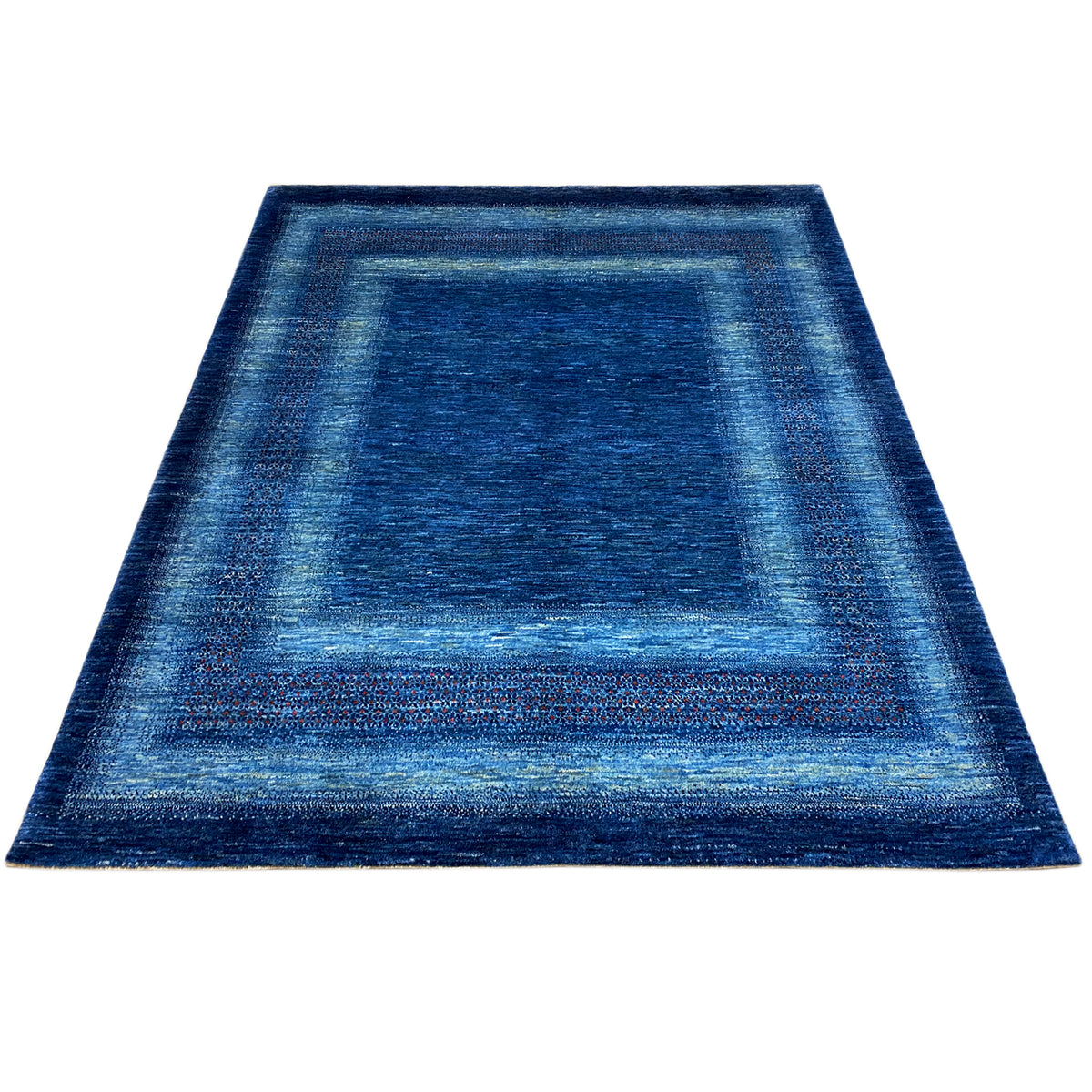 Blue rug with a border and stripe design, flat-woven texture