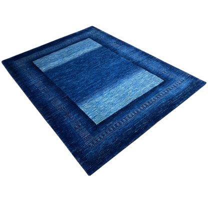 Rug 214x164 cm, blue, diagonal view with a rectangular inner pattern and border