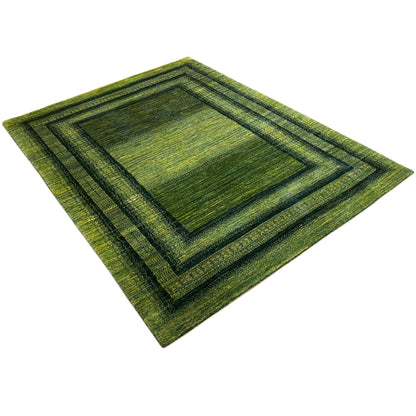 Gabbeh-Luri rug 212x161 cm, green border pattern, placed at an angle from the side
