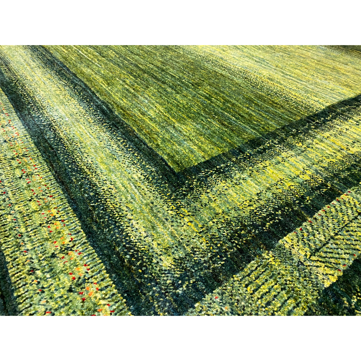 Gabbeh Luri rug 212x161 cm, close-up: green mottled texture with subtle color nuances