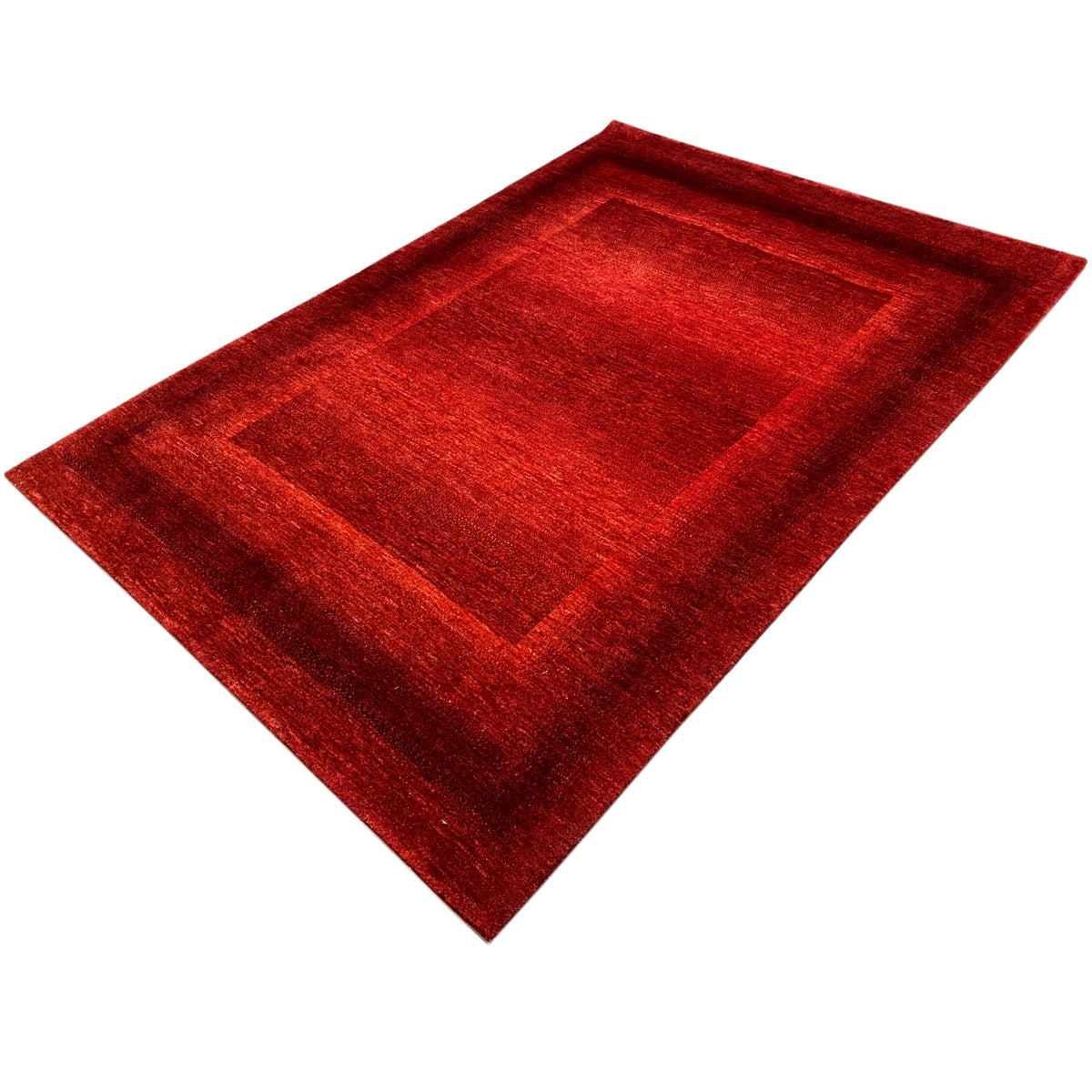 Red carpet with a square center section and border, positioned diagonally